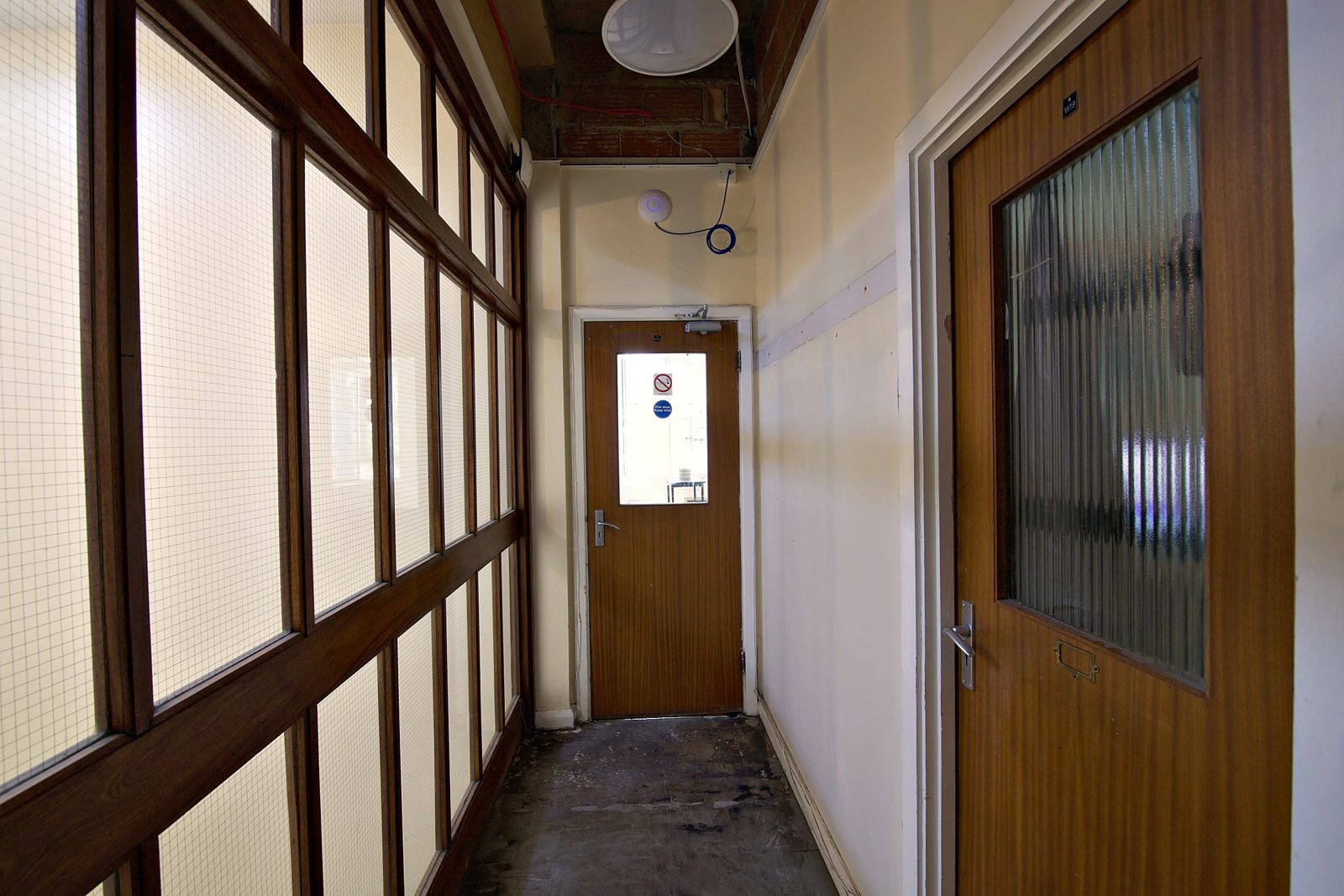 The corridor with glazed doors
