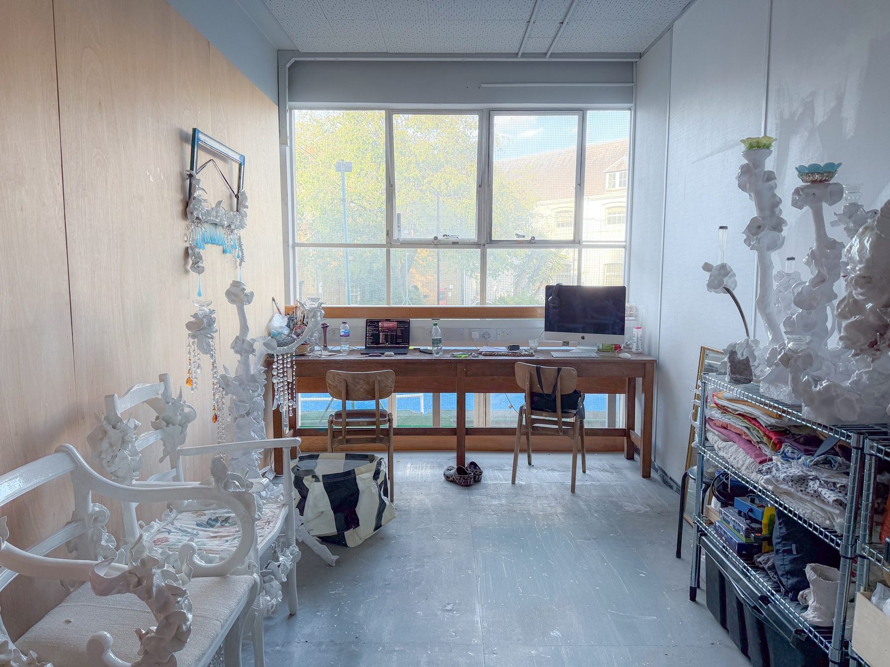 A studio in use with white sculptures