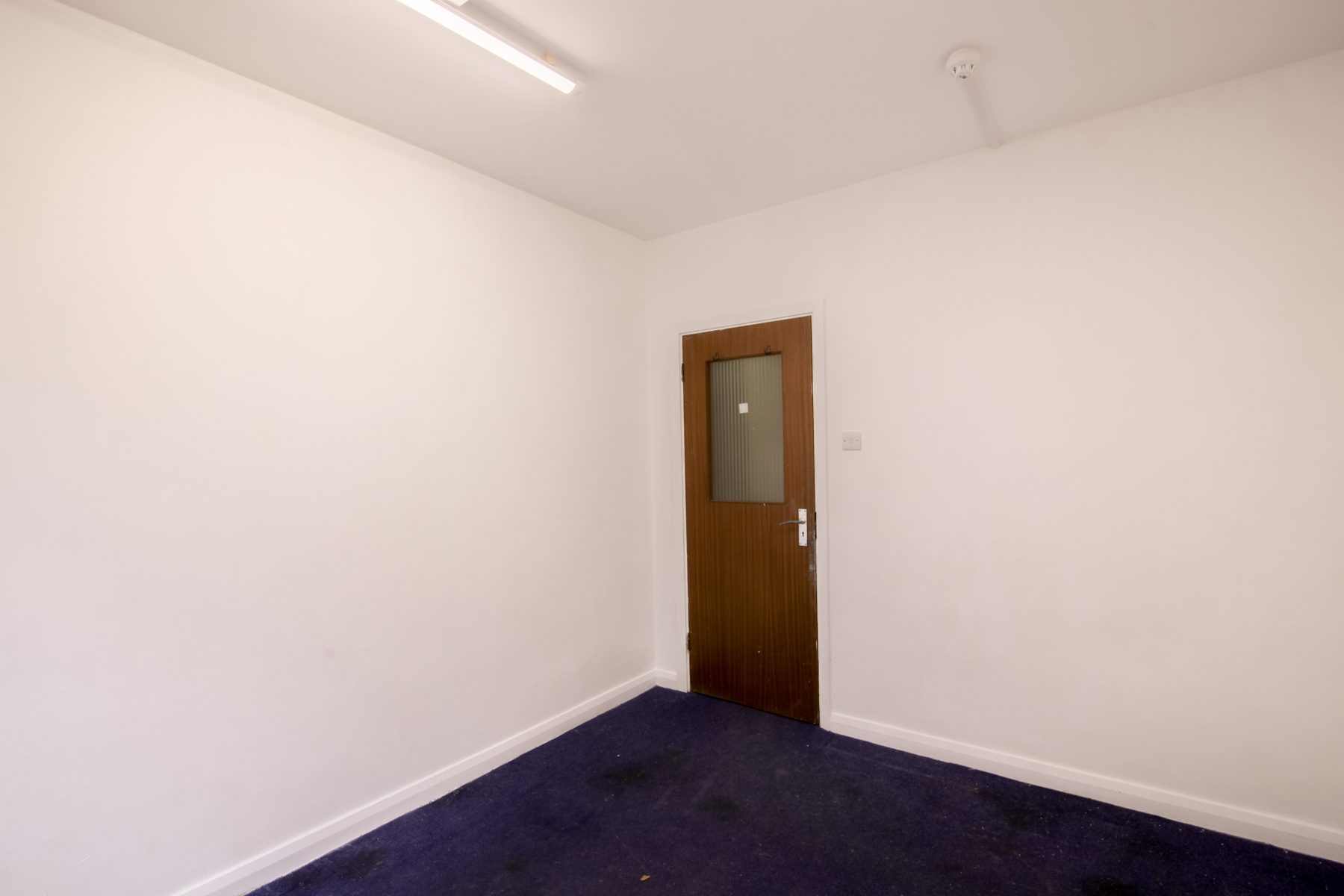 An empty studio with a window door